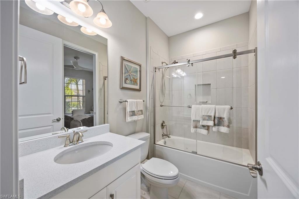 8110 Calle Canovas Street, Unit A Naples, FL 34114 - Photo 20 of 41 a bathroom with a sink a toilet and shower