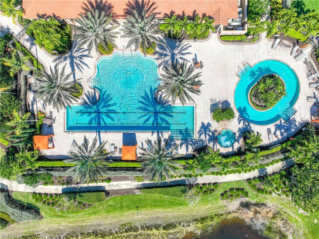 8110 Calle Canovas Street, Unit A Naples, FL 34114 - Photo 27 of 41 an outdoor space with swimming pool and lake view