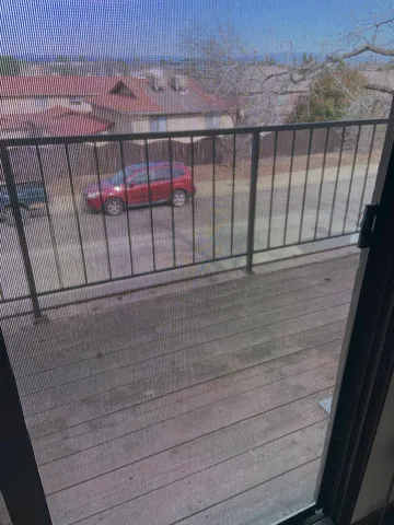 a bathroom with a granite countertop sink and shower
