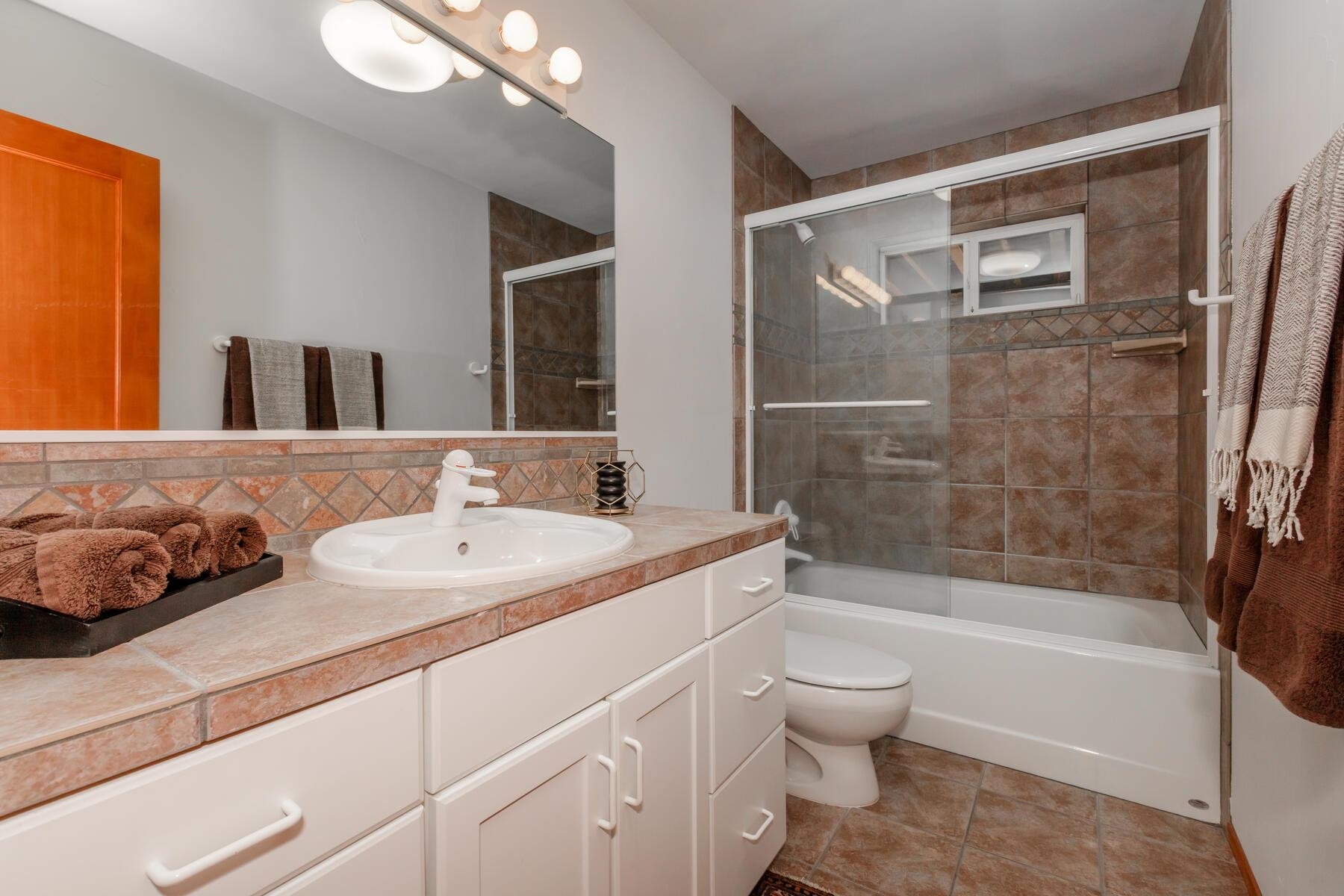 13213 Roundhill Drive Truckee, CA 96161 - Photo 13 of 21 a bathroom with a sink a toilet and shower