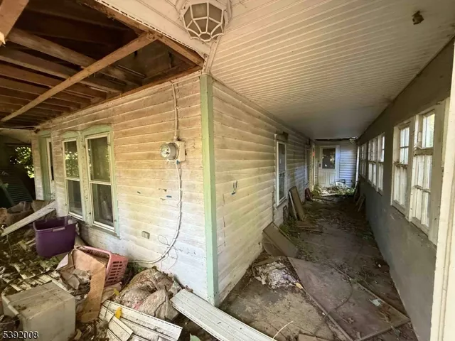 a view of a porch with furniture