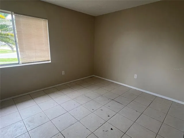 an empty room and window