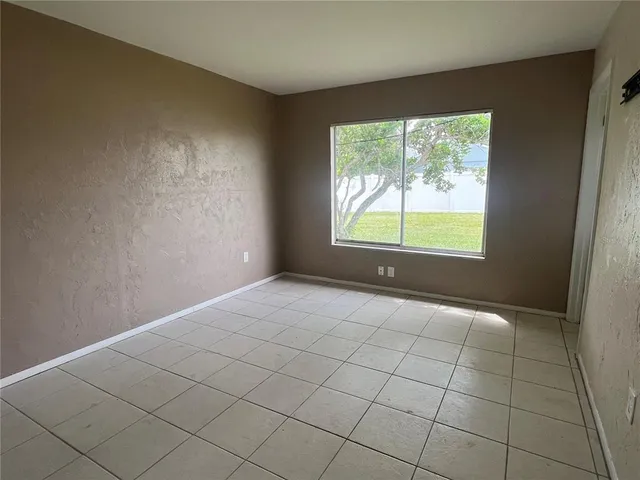 a view of an empty room with a window