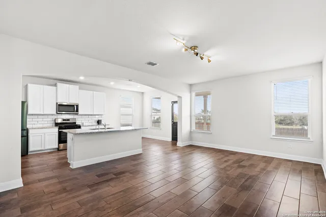 a view of kitchen with sink microwave and stove