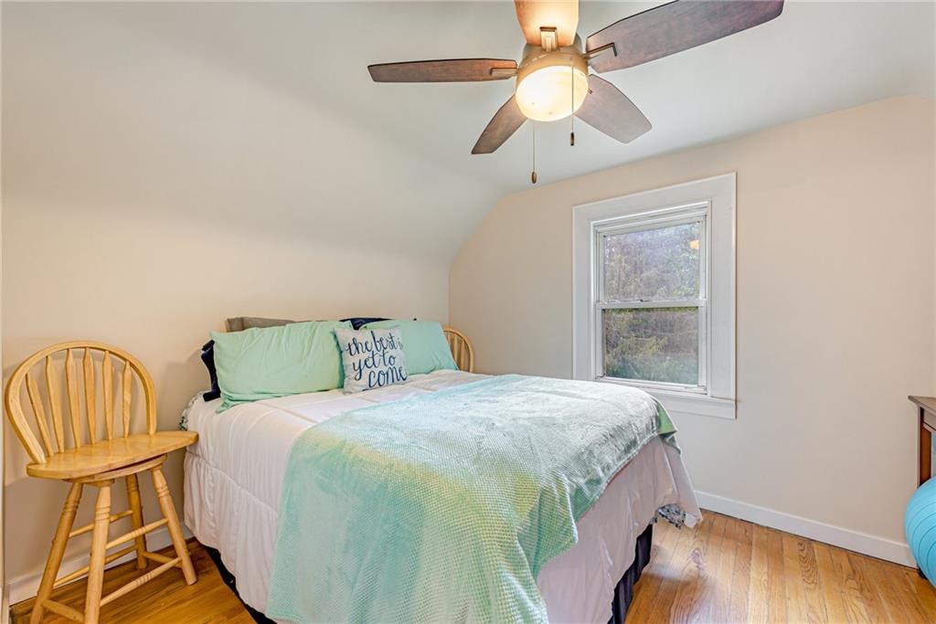 843 Brush Creek Road Penn, PA 15675 - Photo 11 of 22 a bedroom with a bed and a window