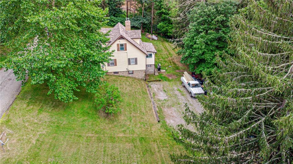 843 Brush Creek Road Penn, PA 15675 - Photo 12 of 22 a view of a house with a small yard