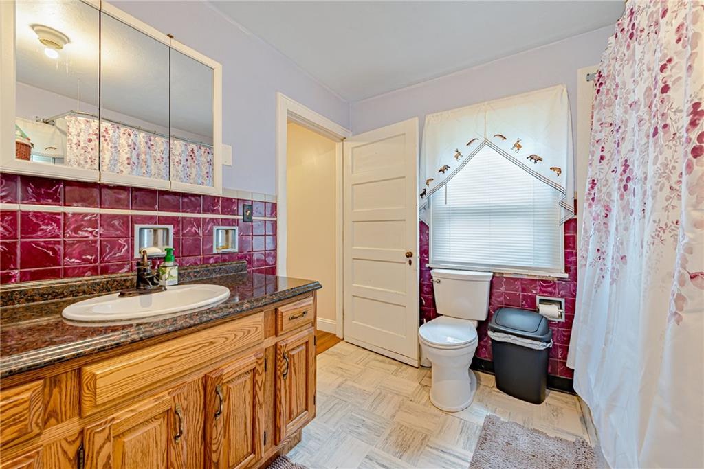 843 Brush Creek Road Penn, PA 15675 - Photo 17 of 22 a bathroom with a sink and toilet