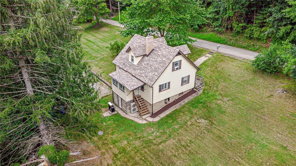 843 Brush Creek Road Penn, PA 15675 - Photo 2 of 22 an aerial view of a house with garden