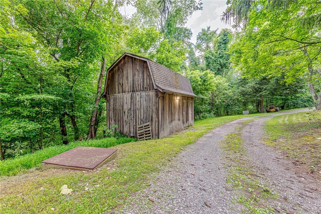 843 Brush Creek Road Penn, PA 15675 - Photo 21 of 22 a backyard of a house with lots of green space