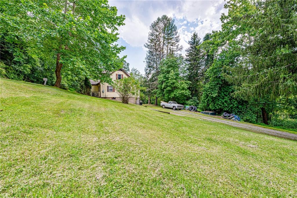843 Brush Creek Road Penn, PA 15675 - Photo 22 of 22 a view of a field with large trees
