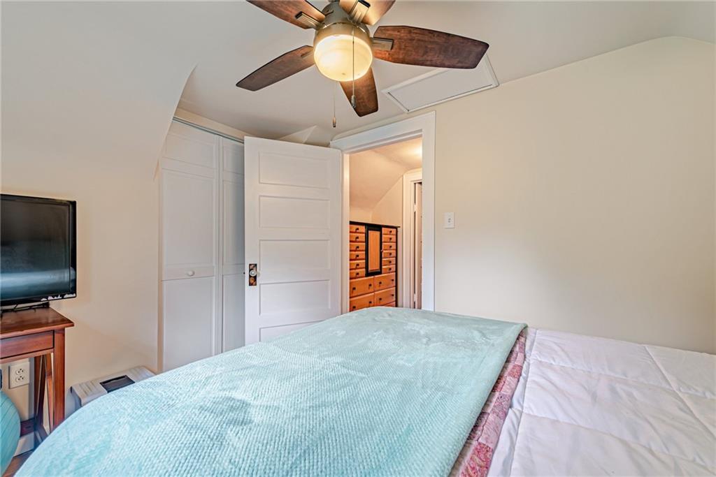 843 Brush Creek Road Penn, PA 15675 - Photo 10 of 22 a bedroom with a bed and a flat screen tv