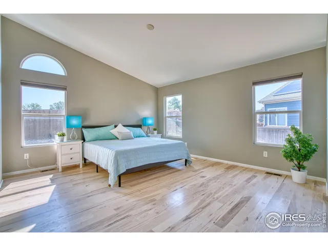 a view of an empty room and wooden floor