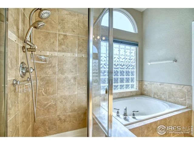 a bedroom with a bed and a table