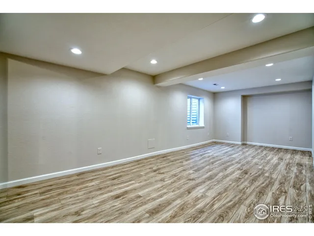 a view of a backyard with a tree