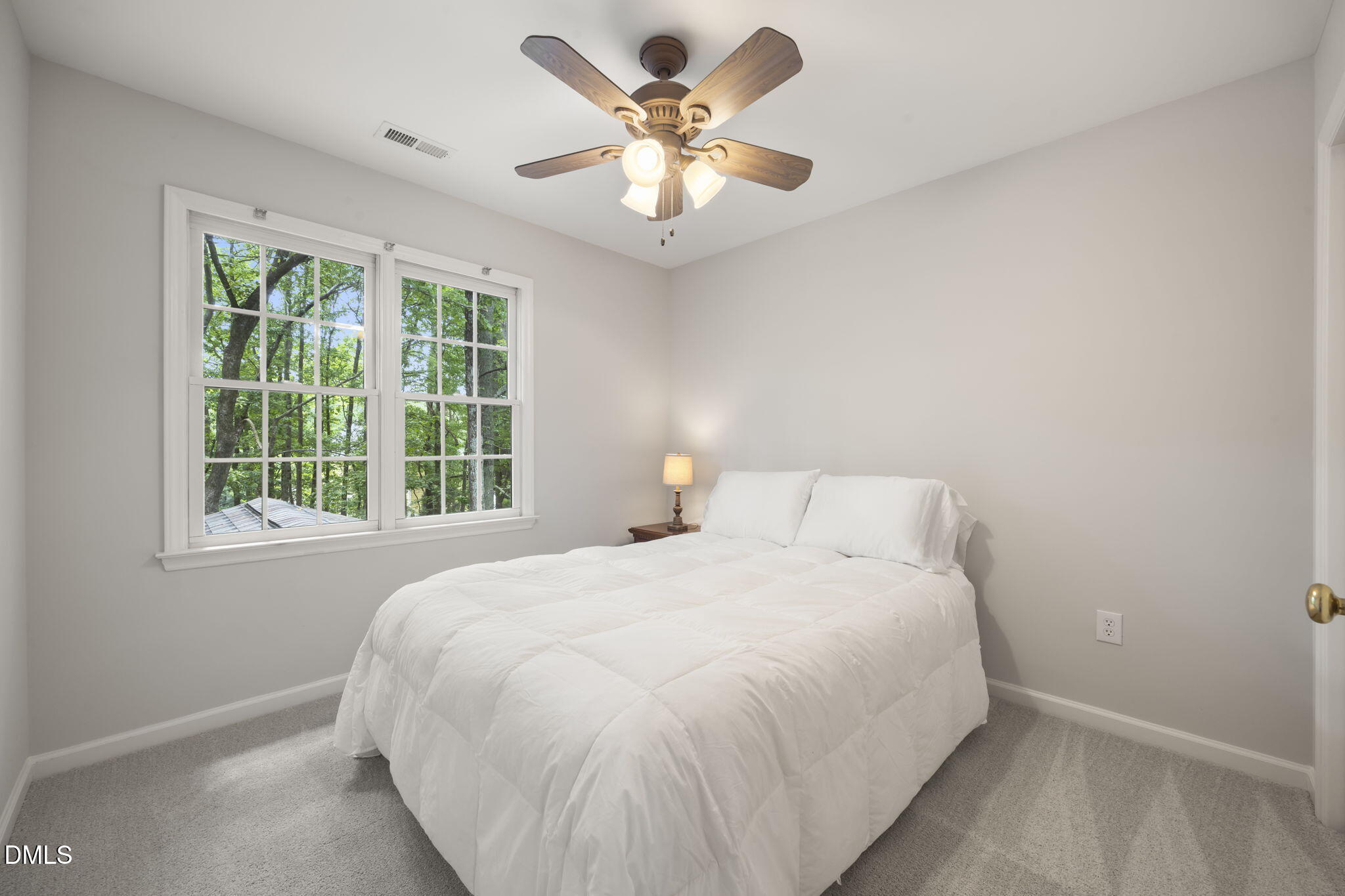 1008 Scotts Ridge Trail Apex, NC 27502 - Photo 43 of 57 a bedroom with a large bed and a large window