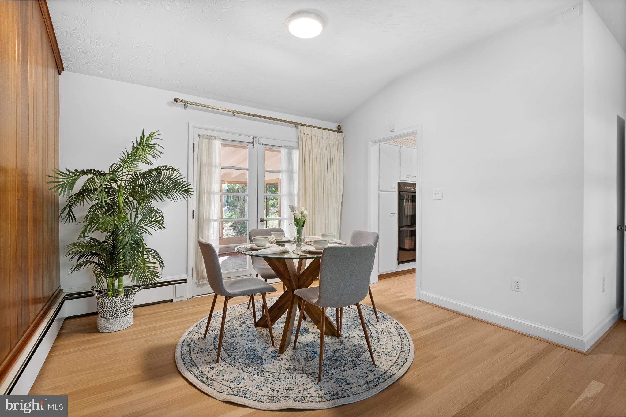 1006 Strout Street Silver Spring, MD 20901 - Photo 12 of 54 a view of a dining room with furniture window and wooden floor