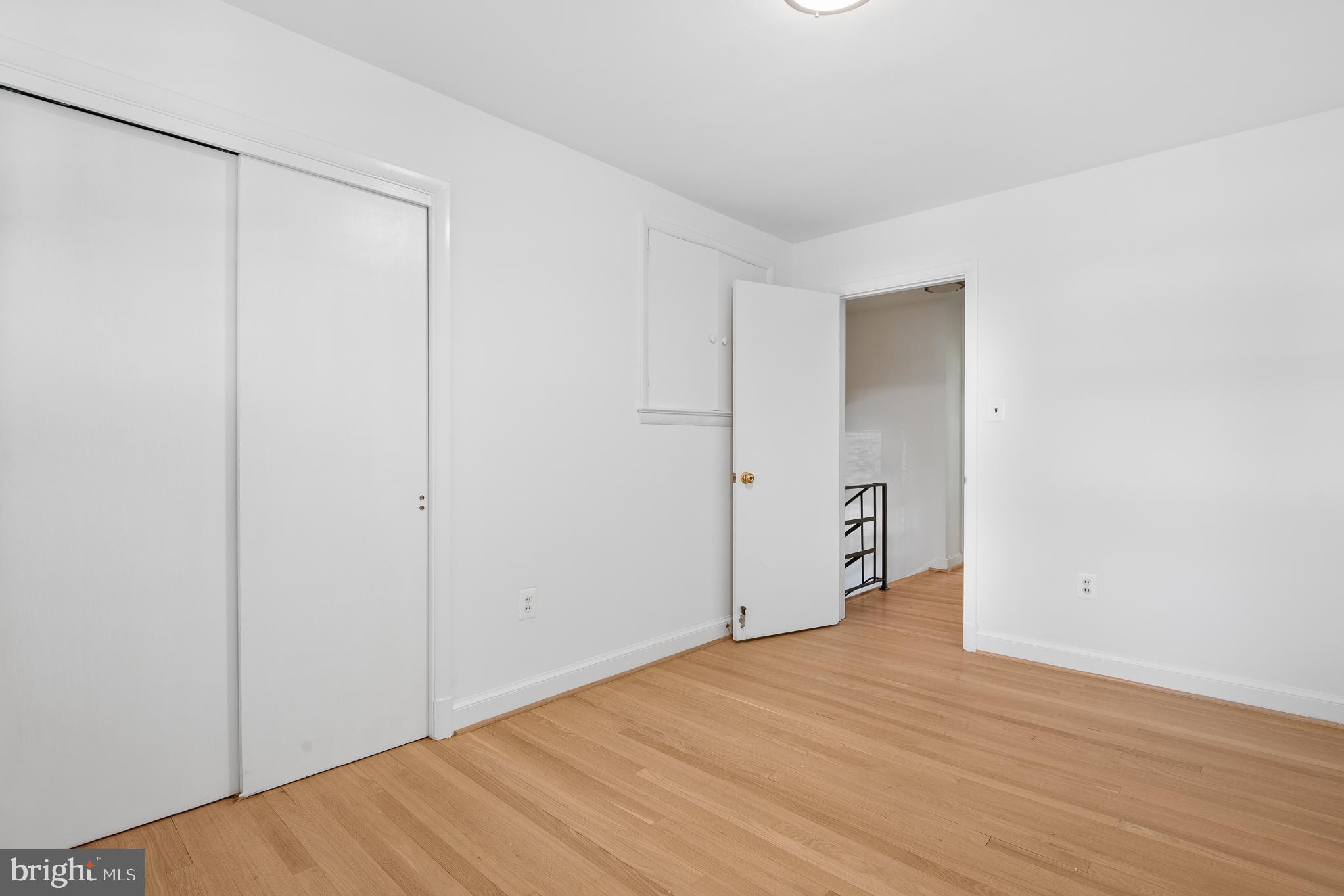 1006 Strout Street Silver Spring, MD 20901 - Photo 29 of 54 a view of an empty room with wooden floor