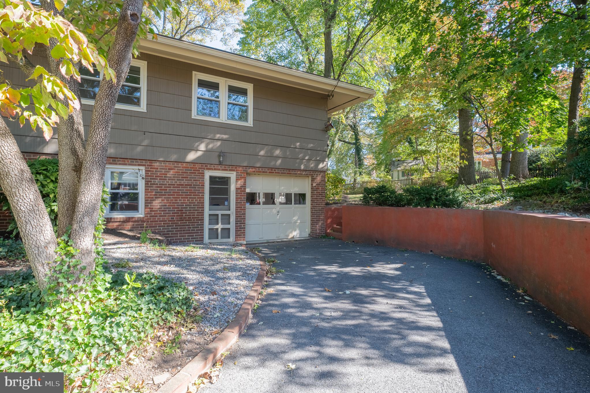 1006 Strout Street Silver Spring, MD 20901 - Photo 54 of 54 a view of a house with a yard and tree in front of it