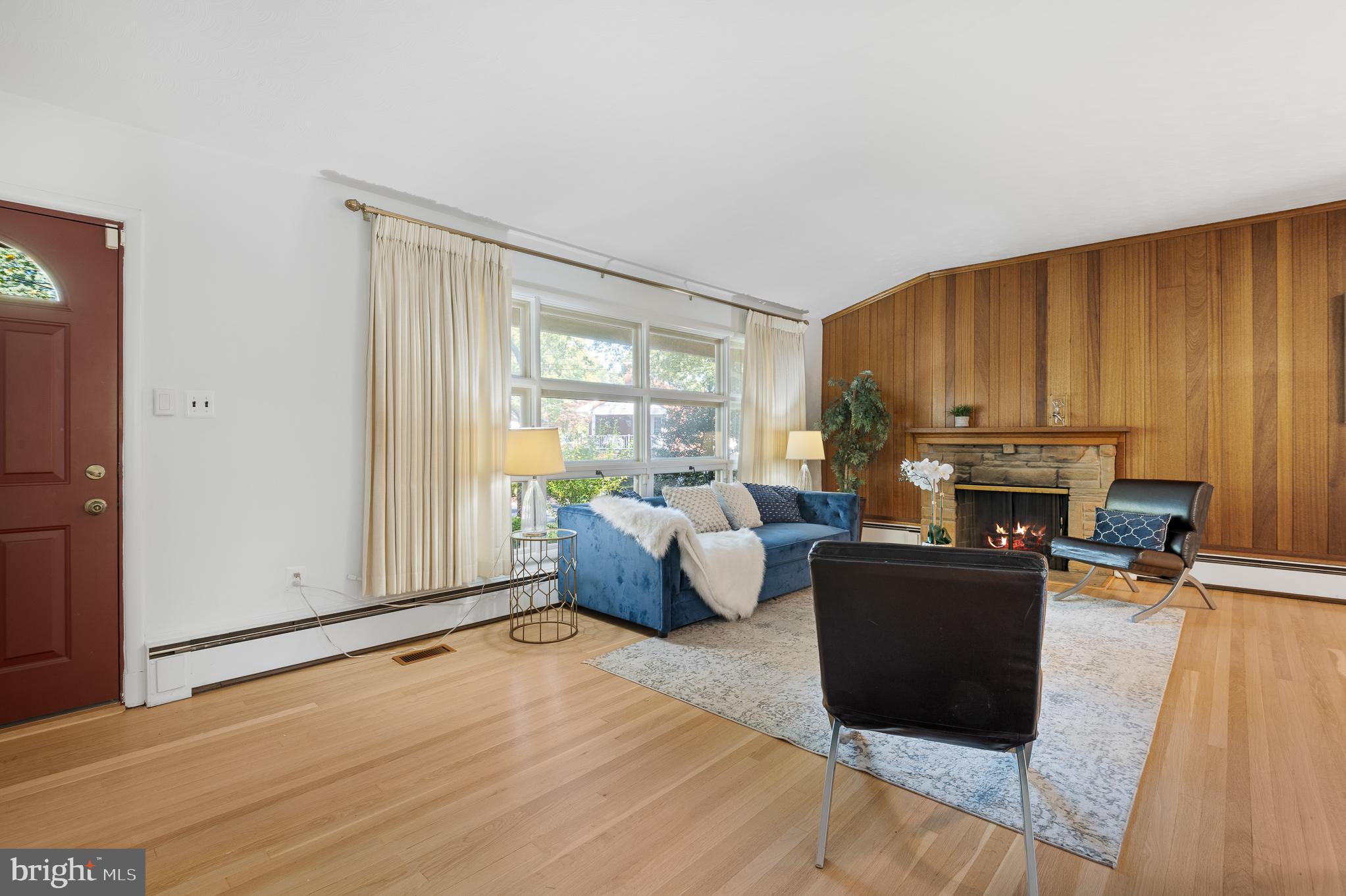 1006 Strout Street Silver Spring, MD 20901 - Photo 8 of 54 a living room with furniture and a fireplace