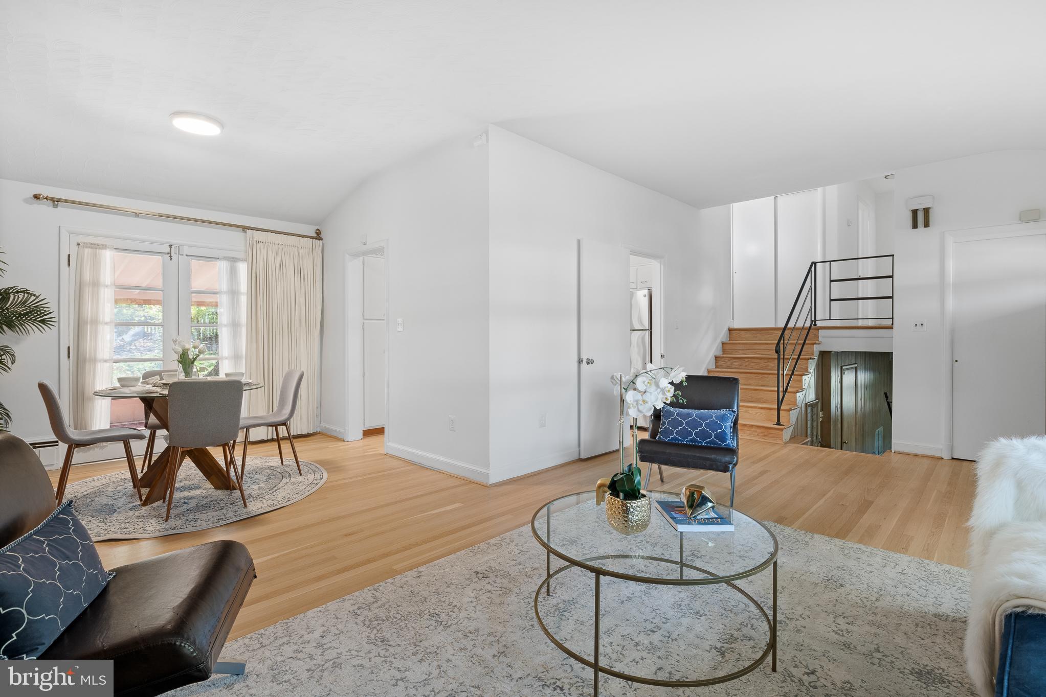 1006 Strout Street Silver Spring, MD 20901 - Photo 10 of 54 a living room with furniture and a dining table