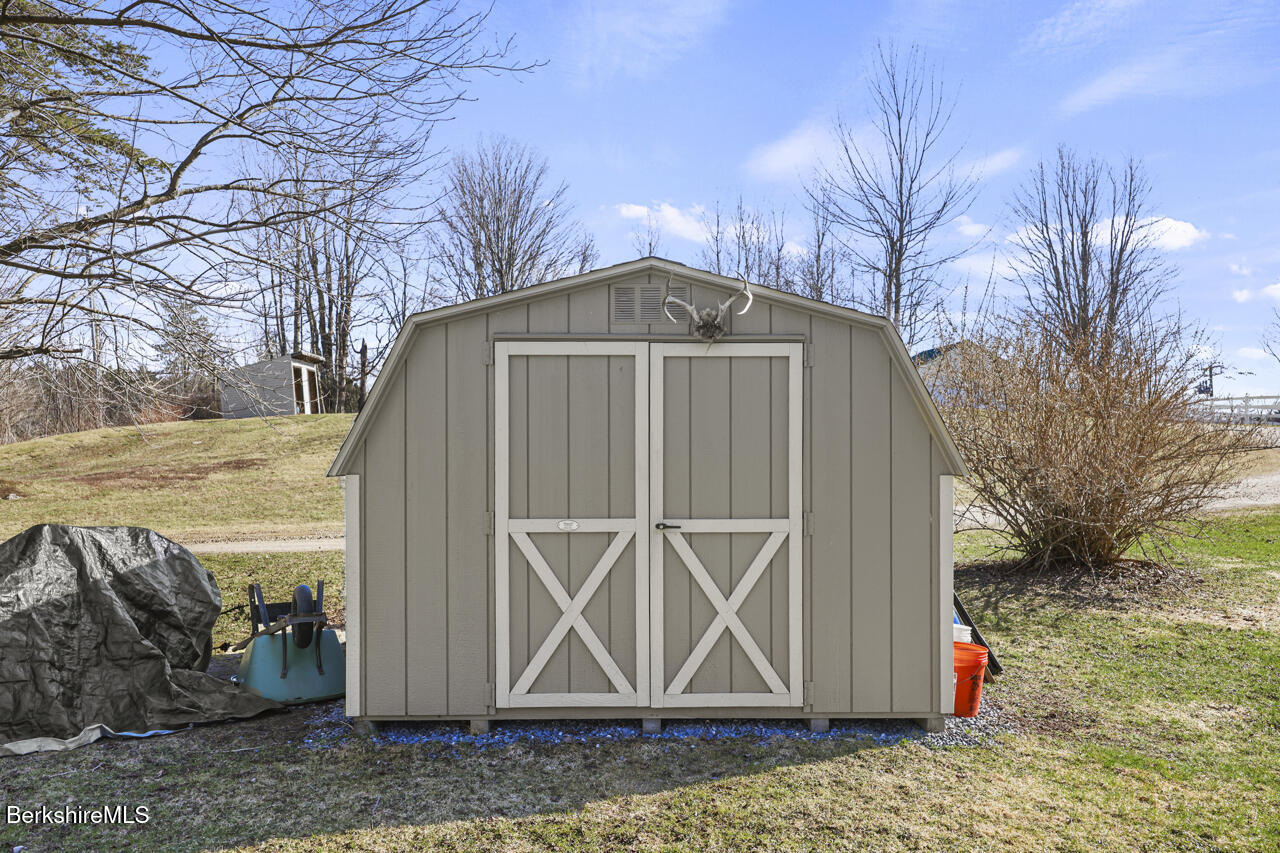 31 New Windsor Road Hinsdale, MA 01235 - Photo 13 of 15 a front view of a house with a yard