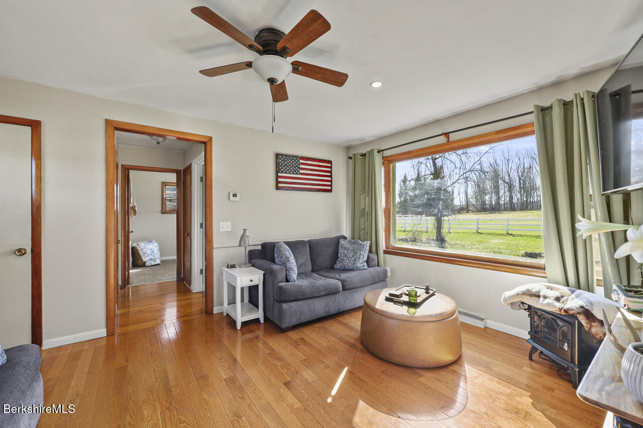 31 New Windsor Road Hinsdale, MA 01235 - Photo 4 of 15 a living room with furniture and a large window