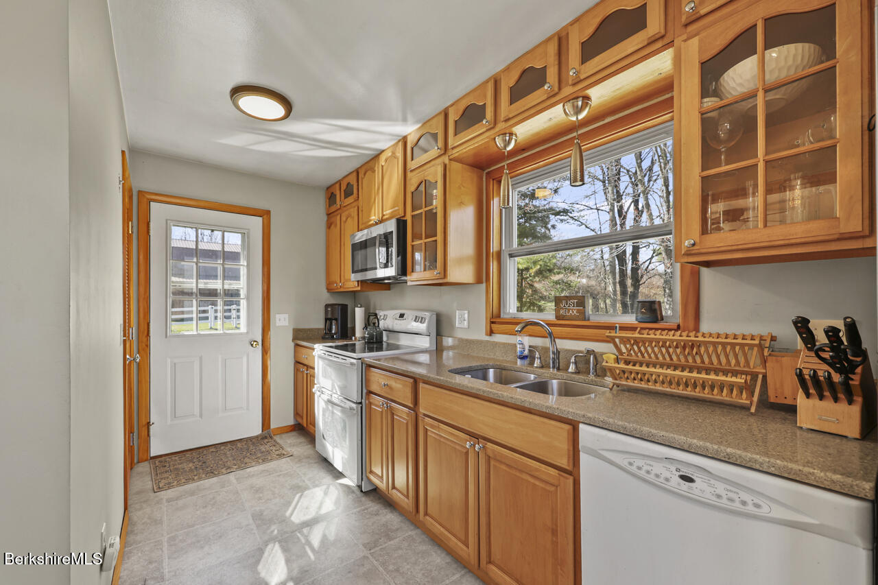 31 New Windsor Road Hinsdale, MA 01235 - Photo 6 of 15 a kitchen that has a sink and a stove in it