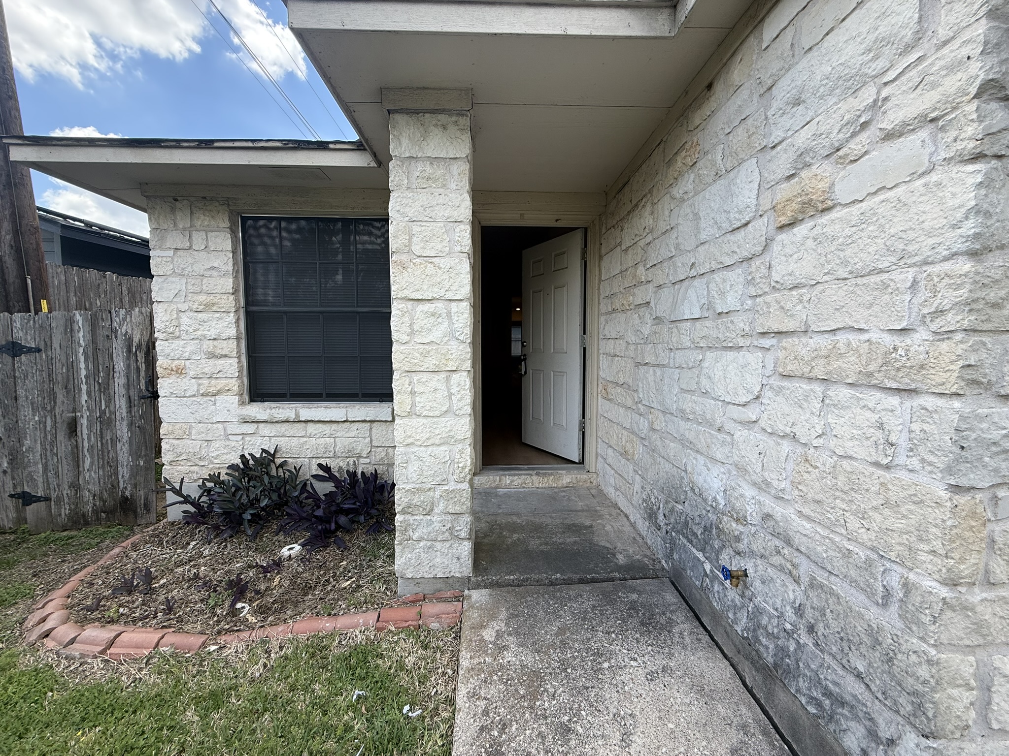 Property entrance with stone siding
