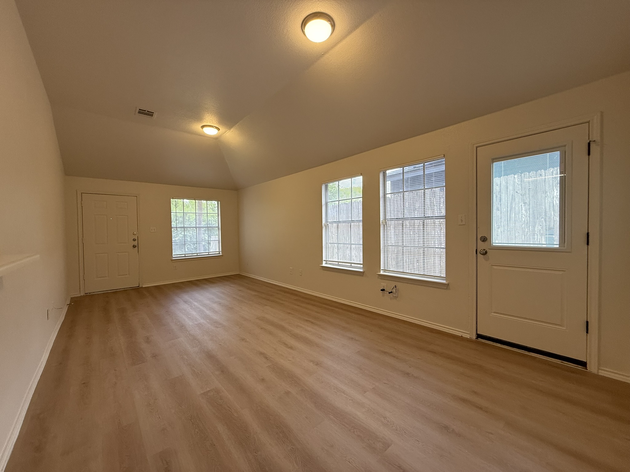 1209 Armadillo Road, Unit A Austin, TX 78745 - Photo 7 of 15 Entrance foyer featuring light wood-style flooring and lofted ceiling