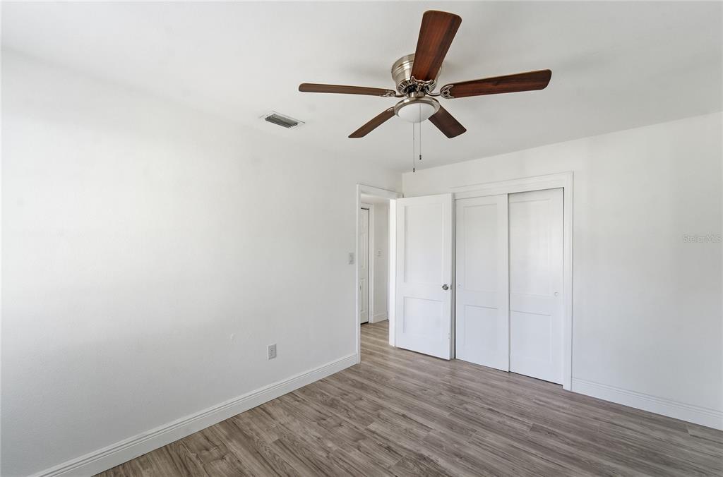 1615 Northeast 9th Street Ocala, FL 34470 - Photo 23 of 24 a view of a room with wooden floor and window