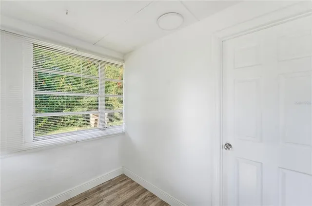 a view of a room that has a window in it