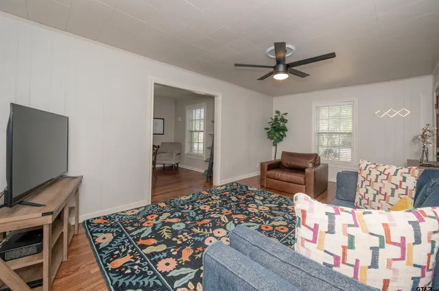a bedroom with furniture and a rug
