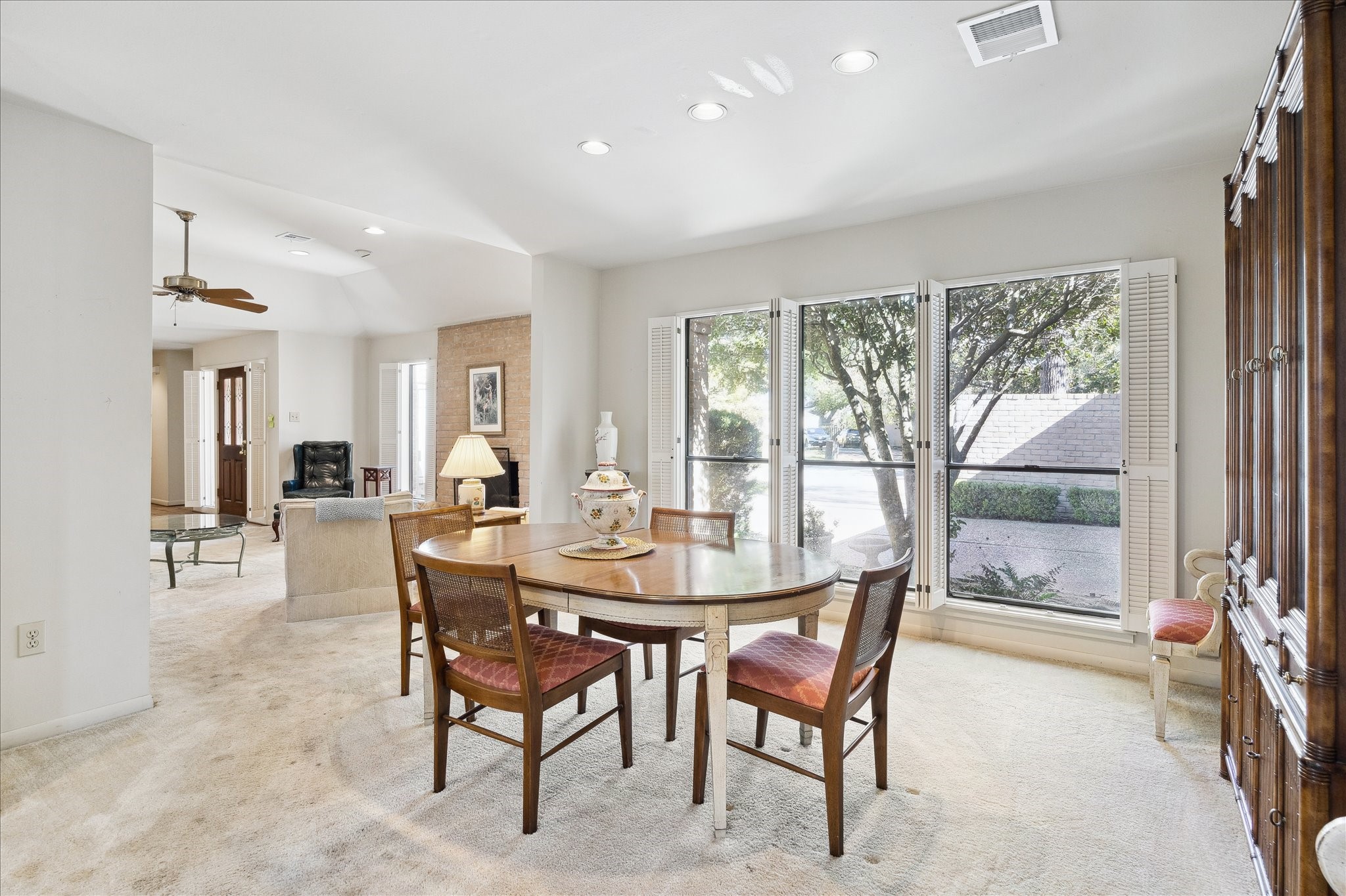 306 Commodore Way Houston, TX 77079 - Photo 11 of 33 a dining room with furniture a rug and a large window