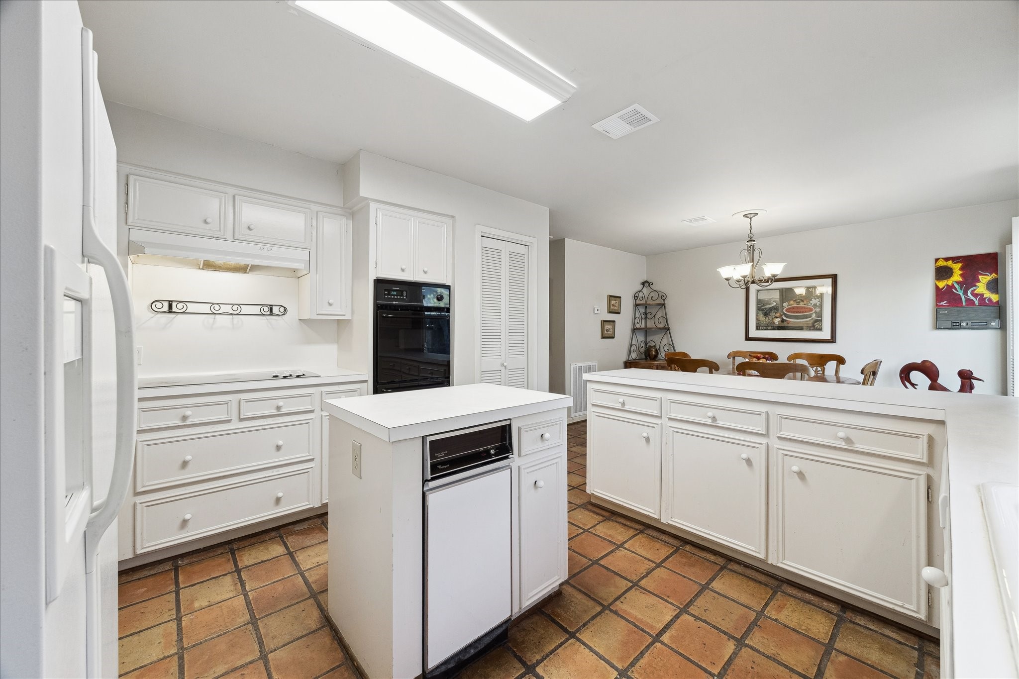 306 Commodore Way Houston, TX 77079 - Photo 15 of 33 a kitchen with white cabinets and white appliances