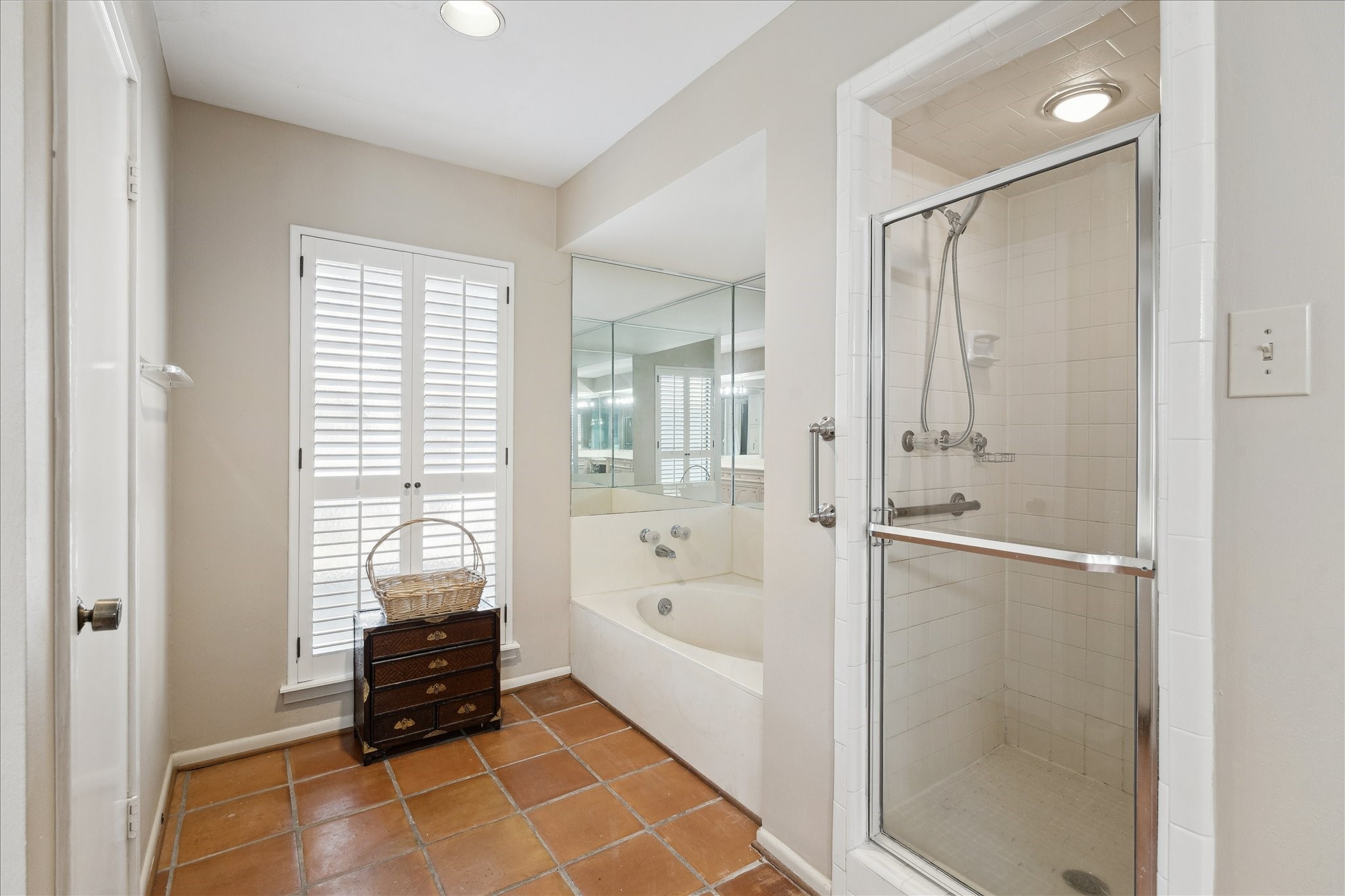 306 Commodore Way Houston, TX 77079 - Photo 21 of 33 a bathroom with a bathtub and a shower