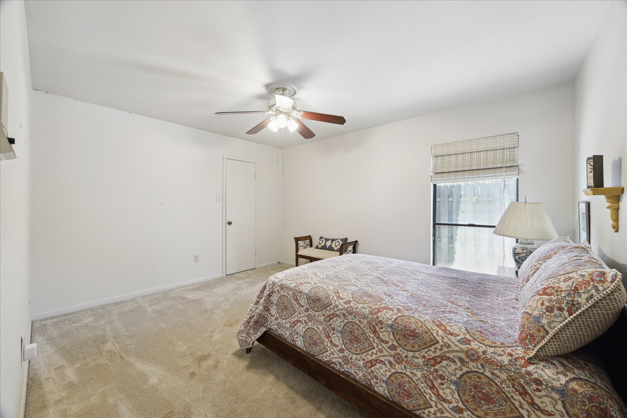 306 Commodore Way Houston, TX 77079 - Photo 25 of 33 a bedroom with a large bed and a chandelier