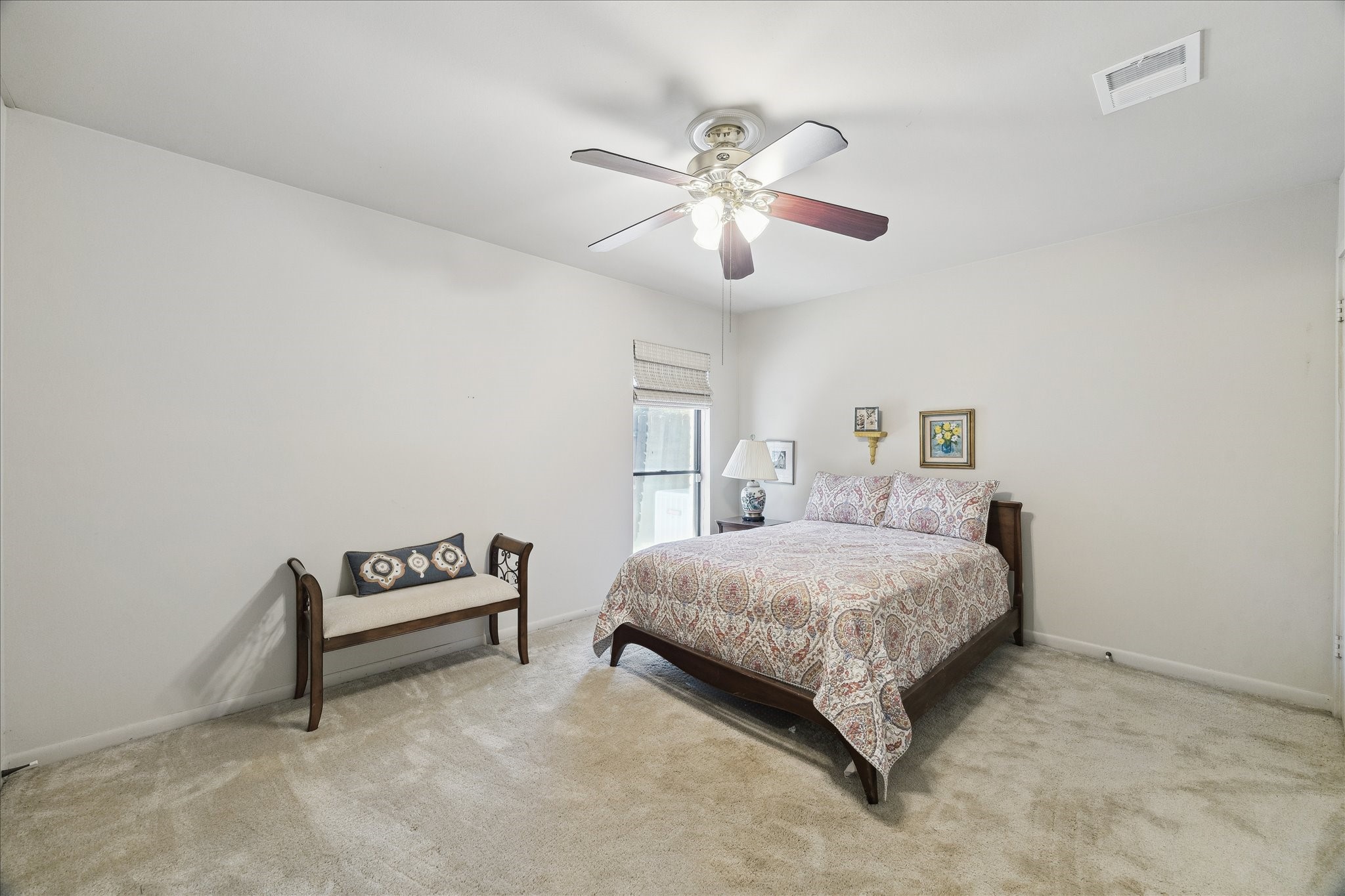 306 Commodore Way Houston, TX 77079 - Photo 26 of 33 a bedroom with a bed chandelier and painting on the wall