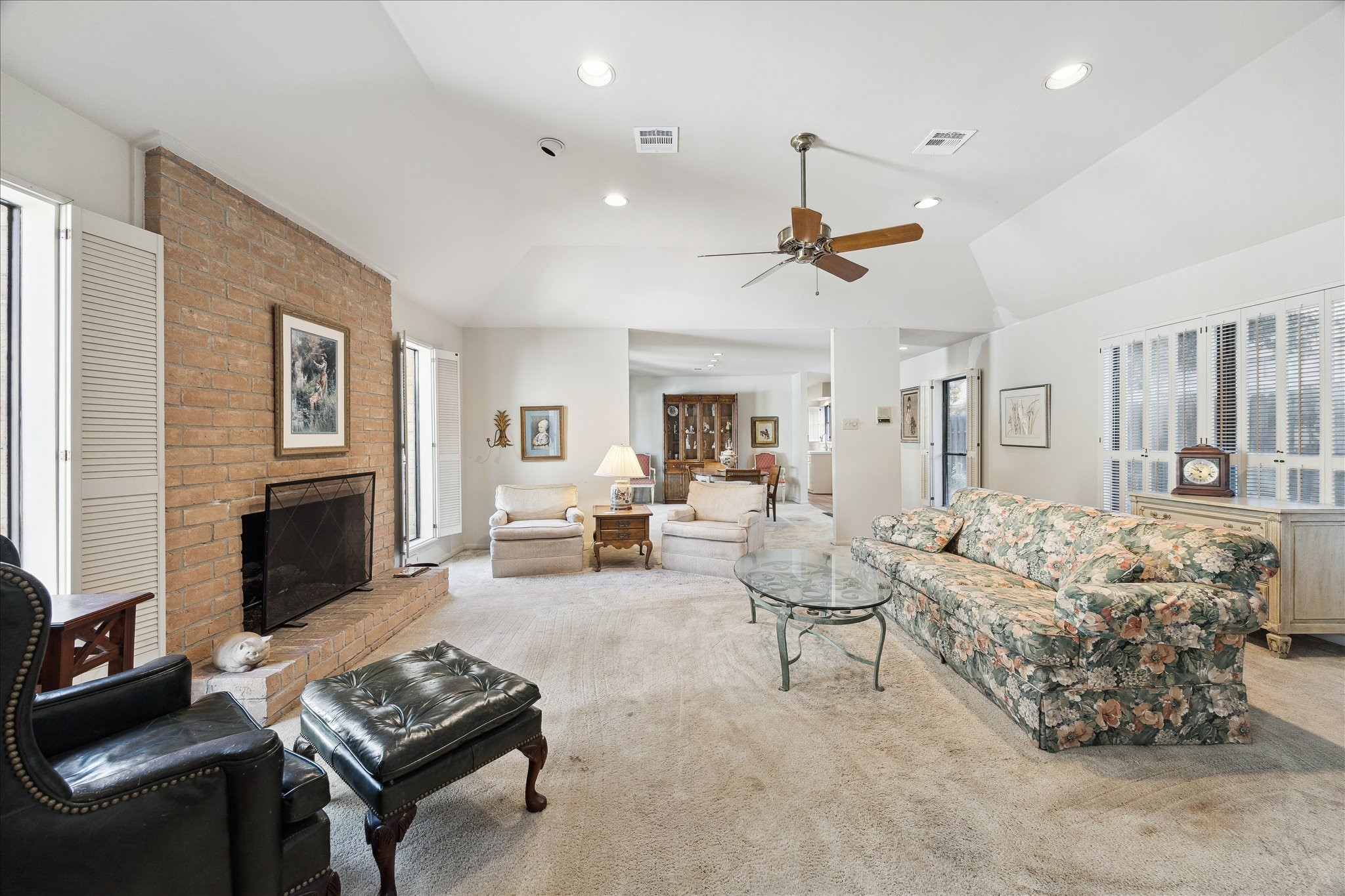 306 Commodore Way Houston, TX 77079 - Photo 7 of 33 a living room with furniture a fireplace and a flat screen tv