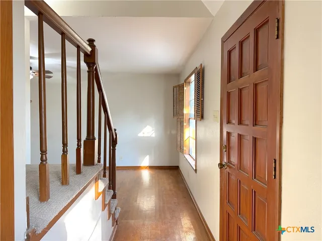 a view of an entryway with stairs
