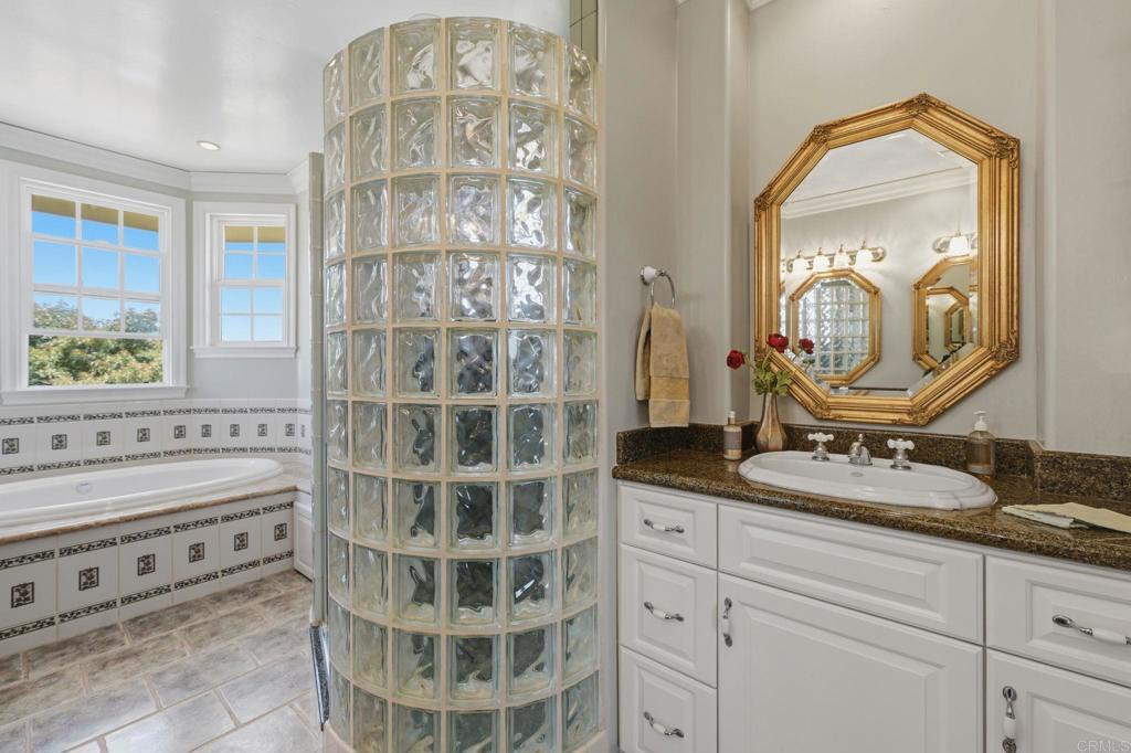 2292 Dos Lomas Fallbrook, CA 92028 - Photo 65 of 71 Primary bathroom with walk in shower, spa tub, water closet, dual sinks and makeup vanity.