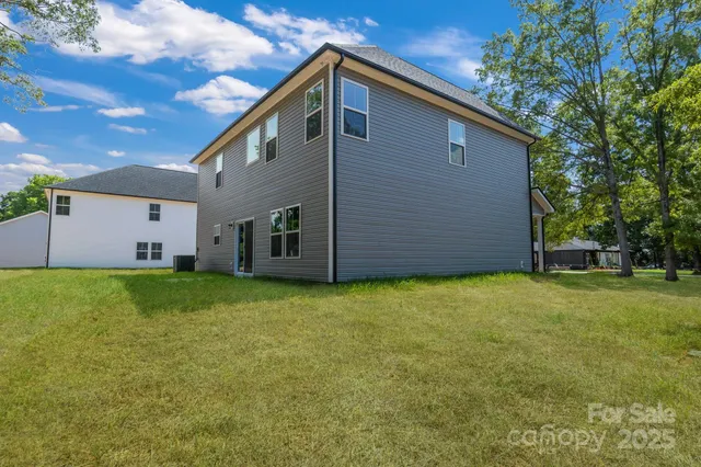a backyard of a house with lots of green space