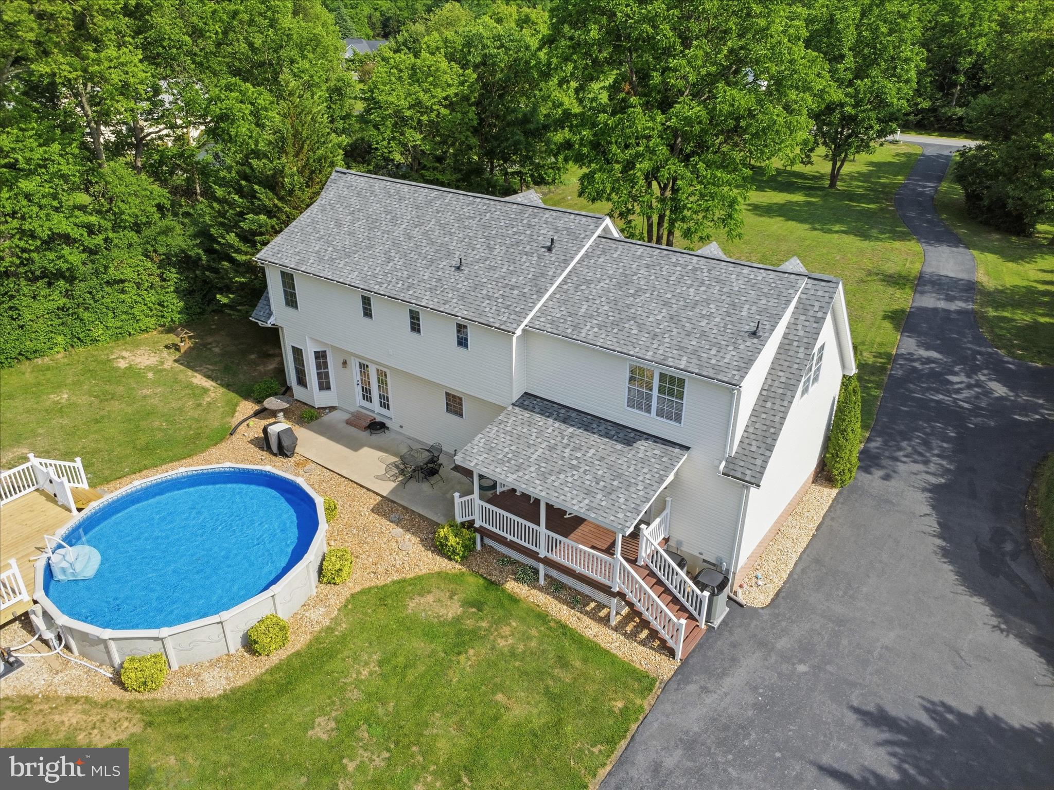 726 Doe Run Road Inwood, WV 25428 - Photo 9 of 68 an aerial view of a house with swimming pool and large trees