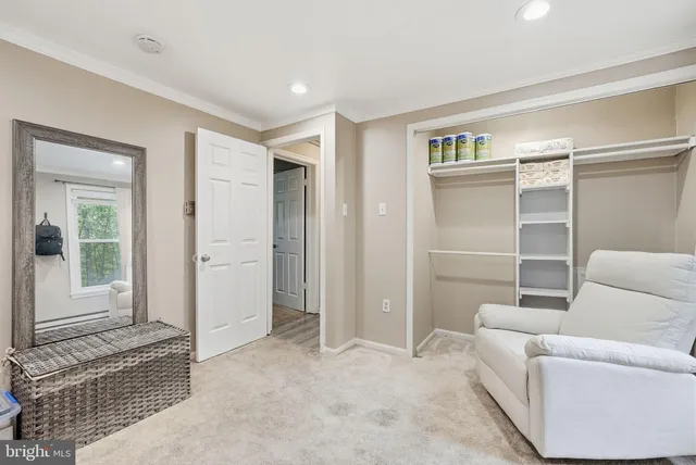 a view of a livingroom with furniture and windows