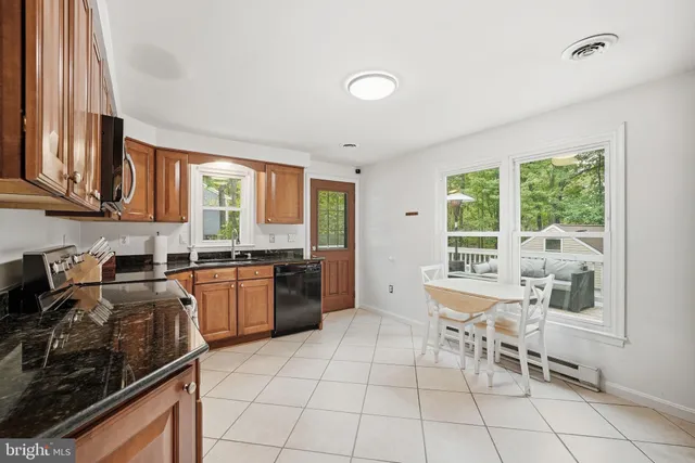 a bedroom with a bed and a mirror