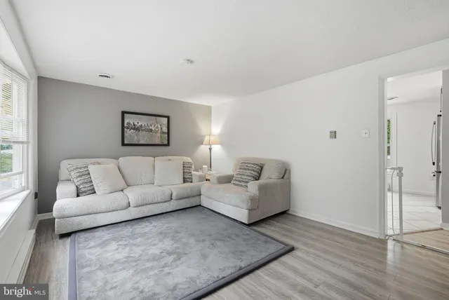 a bedroom with a bed and a ceiling fan