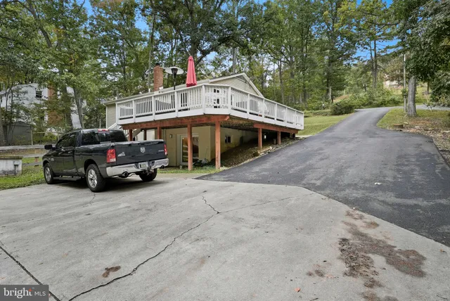 a view of a small house and a yard