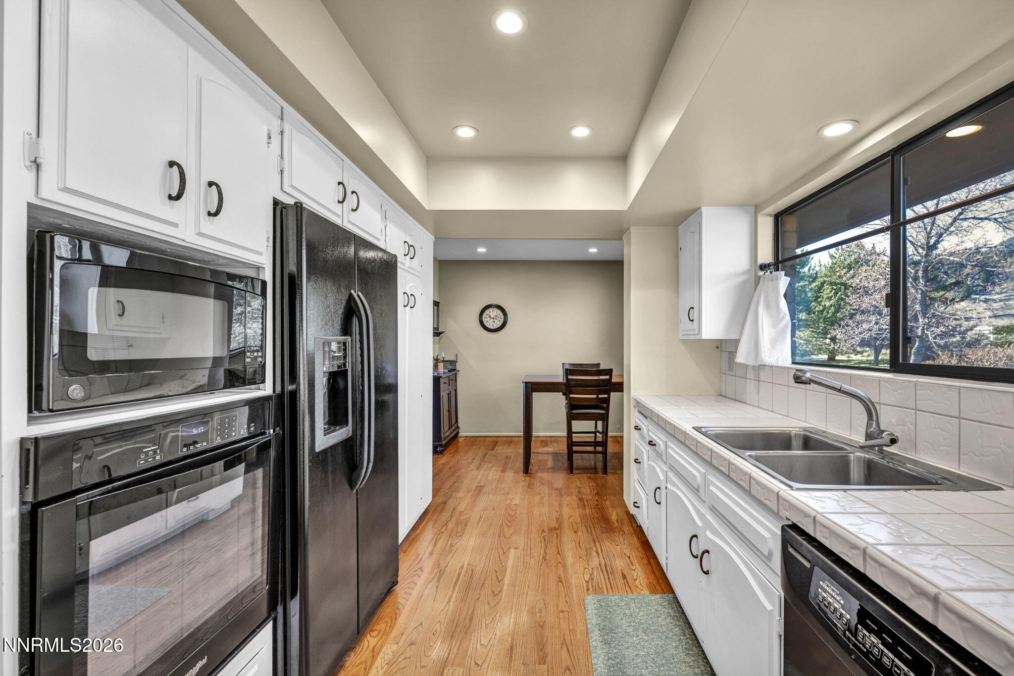 3464 Alpine View Court Carson City, NV 89705 - Photo 27 of 97 a kitchen with granite countertop a sink stove and refrigerator