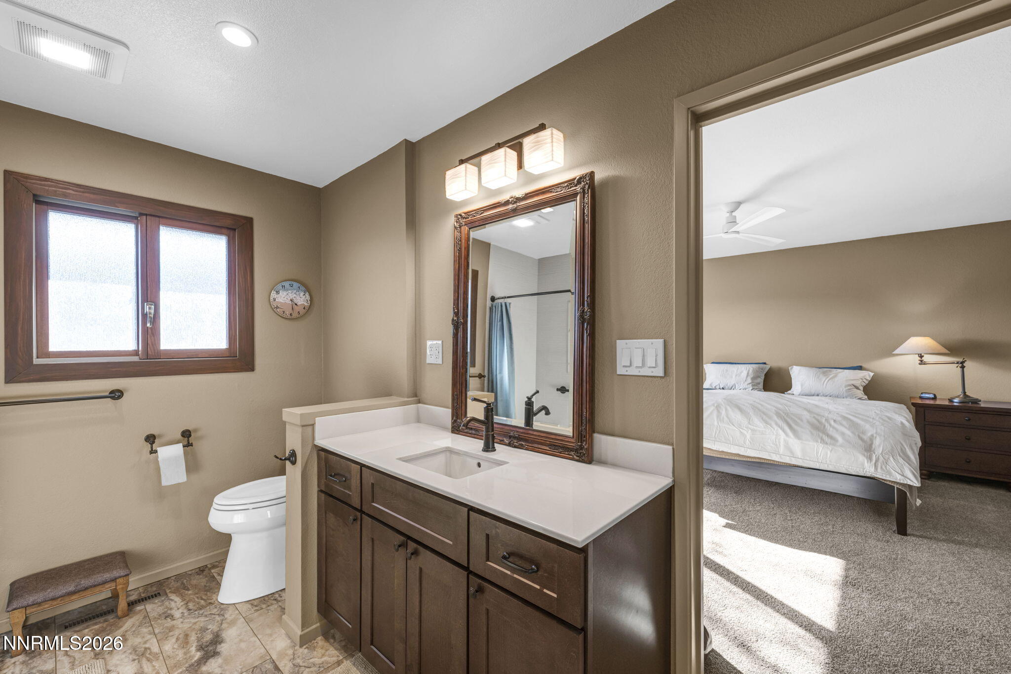 3464 Alpine View Court Carson City, NV 89705 - Photo 36 of 97 a en suite bathroom with a double vanity sink a toilet and a mirror
