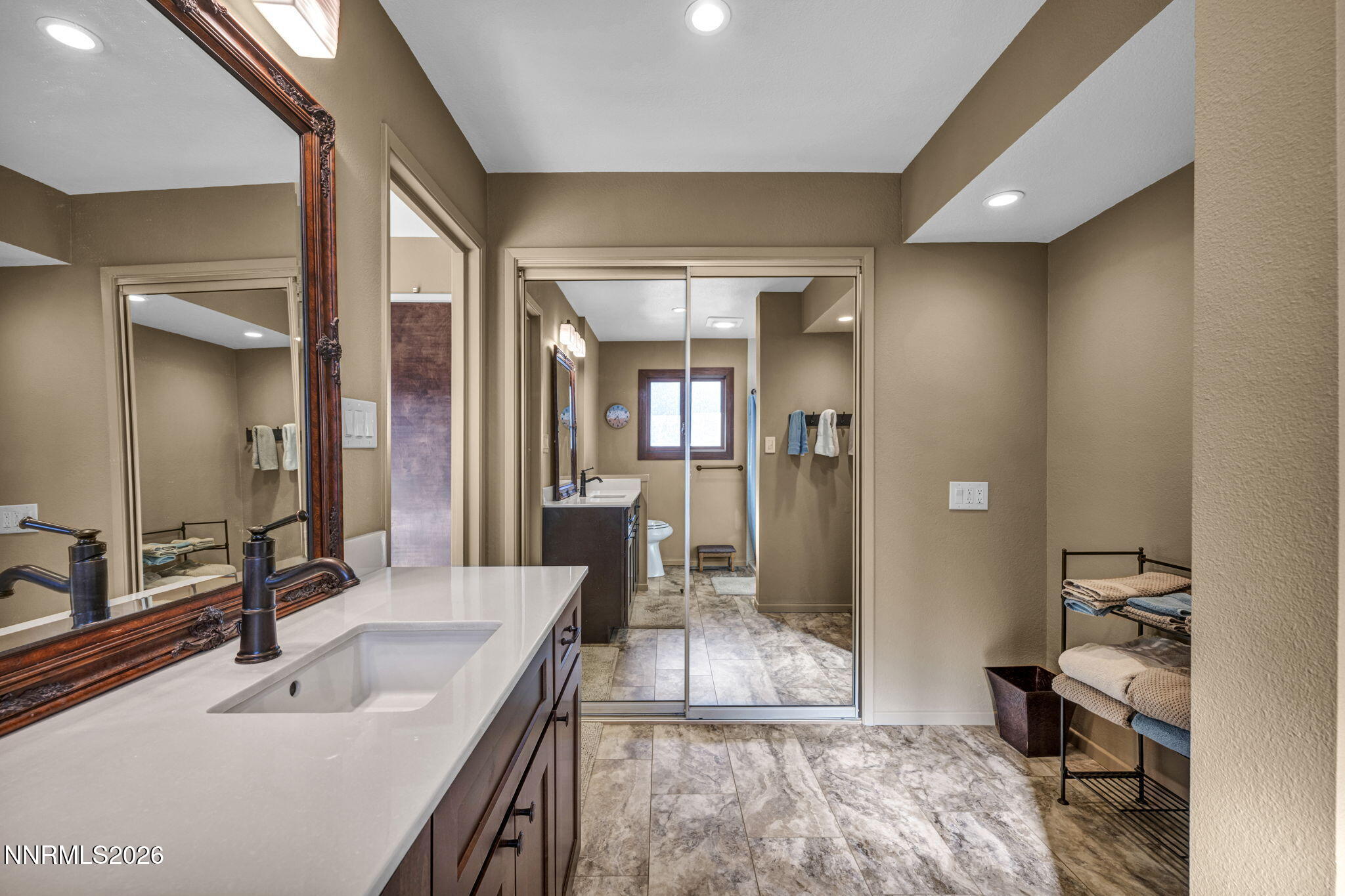 3464 Alpine View Court Carson City, NV 89705 - Photo 39 of 97 a bathroom with a sink double vanity and a mirror