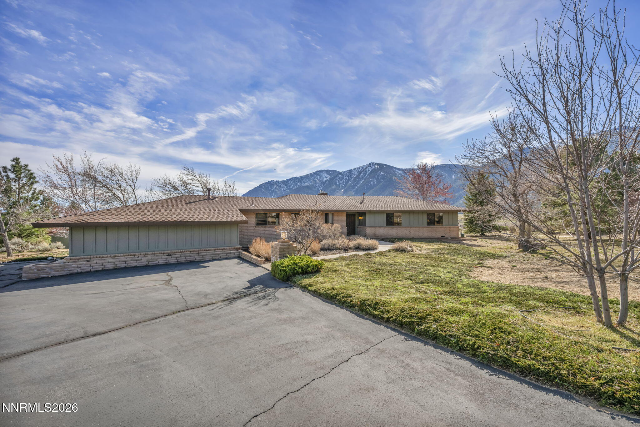 3464 Alpine View Court Carson City, NV 89705 - Photo 69 of 97 front view of a house with yard and mountain view